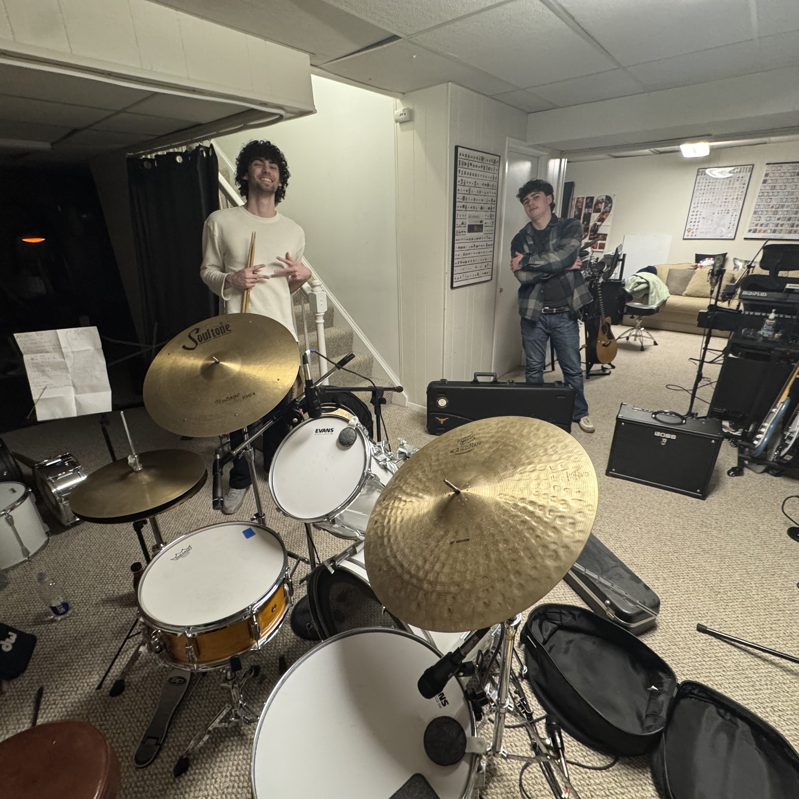 Drum kit with multiple microphones positioned around it