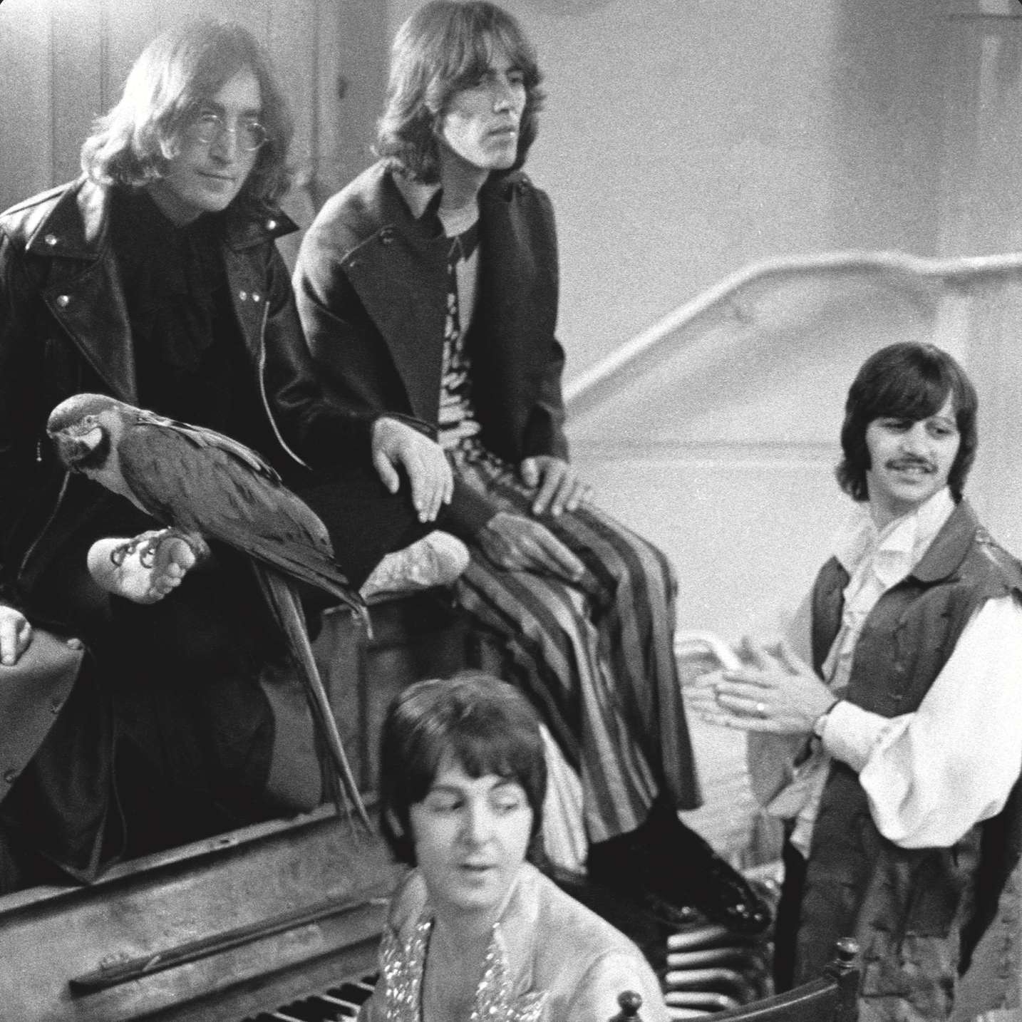 Picture of The Beatles at a piano